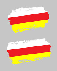 Obraz premium Set of two creative brush painted flags of North Ossetia country with solid background