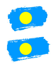 Set of two creative brush painted flags of Palau country with solid background