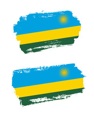 Obraz premium Set of two creative brush painted flags of Rwanda country with solid background