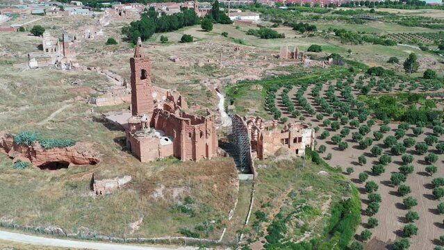 a view of the remains of the old town of Belchite, Zaragoza Spain, destroyed during the Spanish Civil War and abandoned from then, highlighting the San Martin de Tours church, Front view