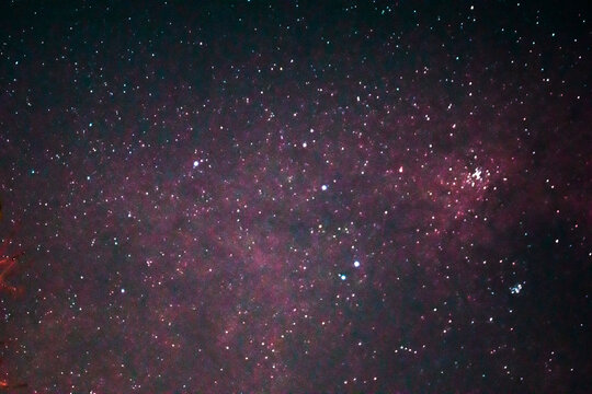 the beauty of the night star banner background. Galaxy of stars in the night sky in red © Rahmad Himawan Photo
