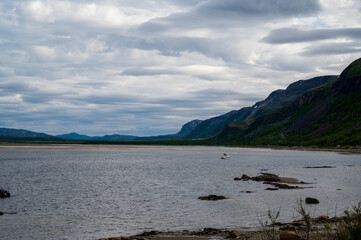 Fototapeta na wymiar View of the lake surrounded by mountains