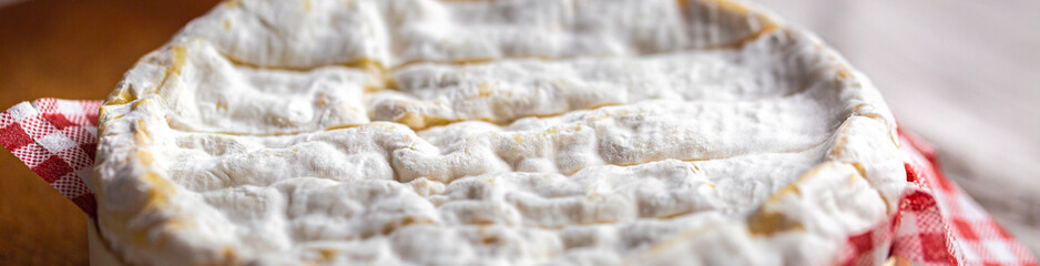 Camembert close-up. Macro photography of cheese for the cover. Camembert advertisement. Cheese for the cover. Brie advertisement. Brie close-up. Cheese with mold close-up. Camembert briquettes. Cheese
