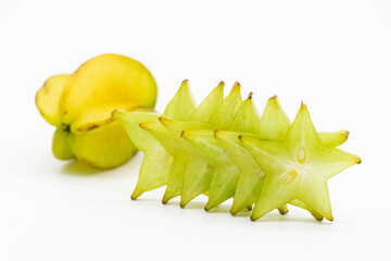 Raw carambolas or Star fruit slices on white background