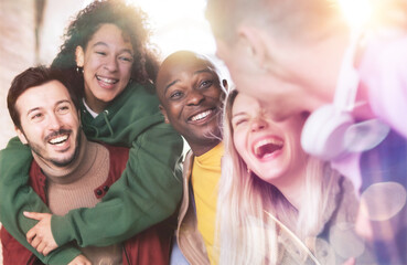 Fototapeta Multiracial friends group having fun in city stret in vacations - Happy young people  laughing - Friendship concept with guys and girls  together obraz