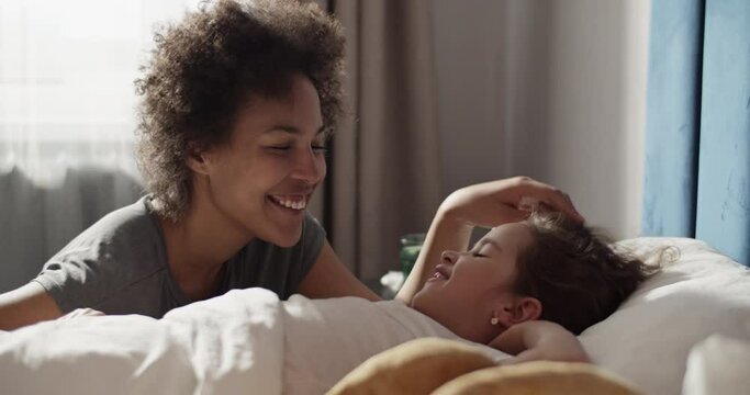 Black mother supporting ill daughter