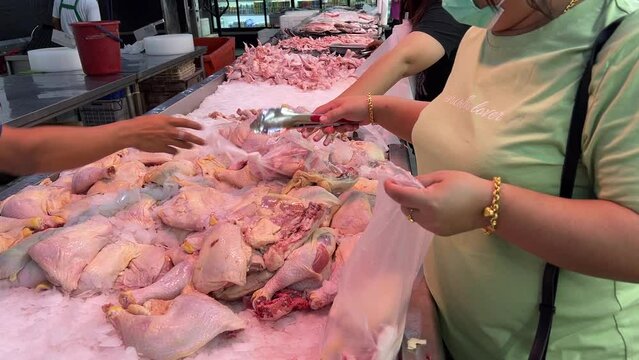 Woman's hand using stainless steel handle choosing raw food in supermarket. July 5, 2022 at CKS Market Tuaran.