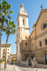 Fototapeta na wymiar View at the Bell tower of Basilica of Santa Maria in Xativa, Spain