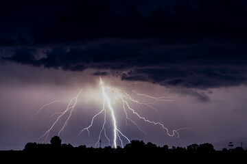 Naklejka na ściany i meble Cloud to ground lightning with copy space in the cloud