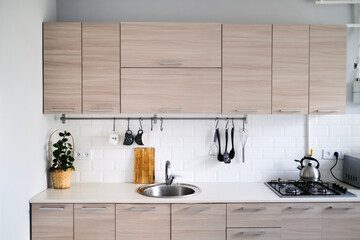 Scandinavian-style kitchen with wood-like facades