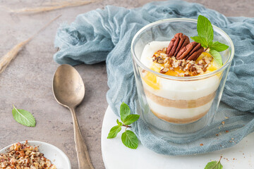 Natas do Ceu is a traditional Portuguese dessert made with cream, eggs and biscuits decorated with pecan nuts and mint leaves