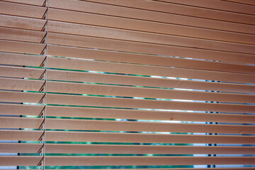 wooden blinds hang on the window