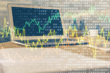 Forex market graph hologram and personal computer on background. Multi exposure. Concept of investment.