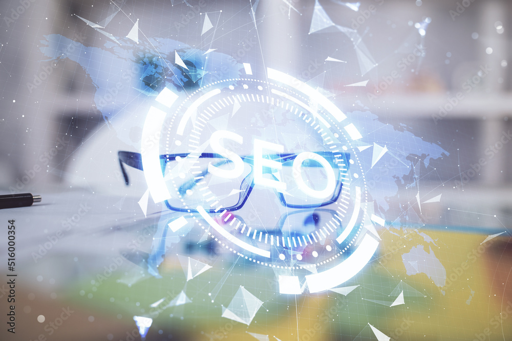 Aufkleber SEO hologram with glasses on the table background. Concept of search engine optimization. Double exposure.