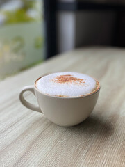 cup of cappuccino with milk