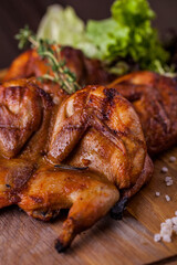 Grilled quail with thyme sprigs