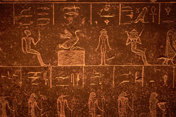 Hieroglyphic carving on an ancient Egyptian sargophagus in an ancient temple, selective focus