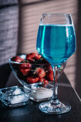 Beautiful drink concept - champagne and strawberries. Vertical photo with post processing