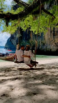 Koh Hong Island Krabi Thailand, a couple of men and women on the beach of Koh Hong, a tropical white beach with Asian women and European men in Krabi Thailand