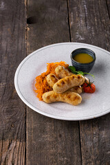 Grilled pork sausages with stewed cabbage