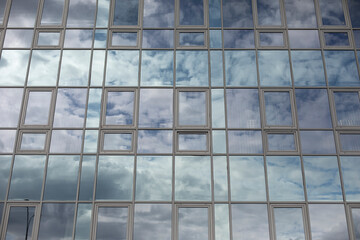 Fototapeta na wymiar Windows in building. Mirror surface in building.