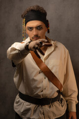 Fototapeta na wymiar Confident young pirate point his hand to the camera