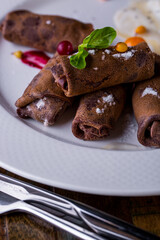 Chocolate pancakes with homemade cottage cheese