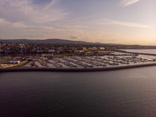 Fototapeta premium Aerial view of the sunset over Dun Laoghaire harbour with yachts, Dublin