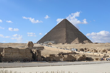 Pyramids of Giza. Scene with tourists near pyramid in Egyptian desert. Travel to the African...