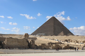 Pyramids of Giza. Scene with tourists near pyramid in Egyptian desert. Travel to the African...