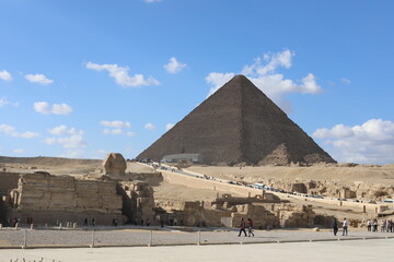 Pyramids of Giza. Scene with tourists near pyramid in Egyptian desert. Travel to the African...