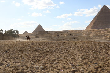 Pyramids of Giza. Scene with tourists near pyramid in Egyptian desert. Travel to the African...