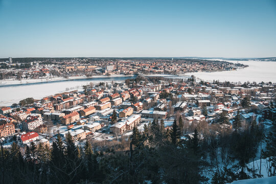 &Ouml;stersund (Sweden Lapland) in March. Aerial view of cityscape panorama with snow and frozen lake Storsj&ouml;n.