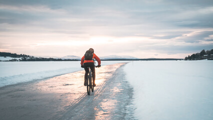 Mountain biker on ice skating track called 