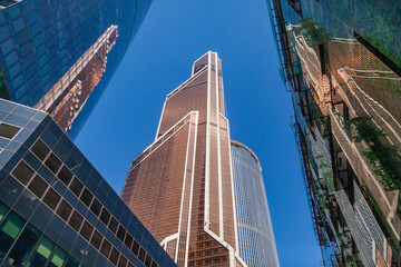 Naklejka premium Moscow, Russia, on July 3, 2022. Urban view. Skyscrapers of Moscow city district against the background of the blue sky
