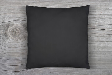 Black Throw Pillow Mockup on Weathered Wood