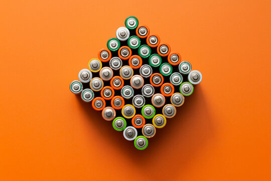 Lots Of Batteries On The Orange Table