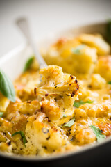 baked cauliflower with vegetables and cheese and scrambled eggs