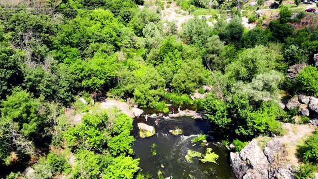 Drone shot Butsky Canyon Ukraine. Aerial view of a rocky canyon on the Gorny Tikich River near the village of Buki. River Gorny Tikich in Proterozoic granites. Ancient deep and narrow canyon 