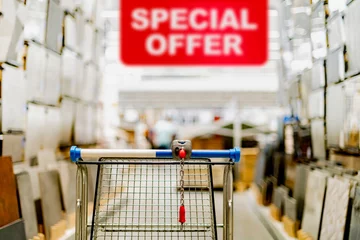 Fotobehang A shopping cart in a home improvement store © monticellllo