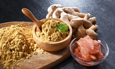 Bowls with marinated and ground ginger and its fresh rhizome