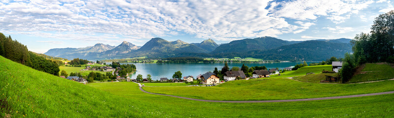 Lake Wolfgang (Wolfgangsee) in the region of Salzkammergut in the state of Salzburg in Austria with austrian alps - obrazy, fototapety, plakaty