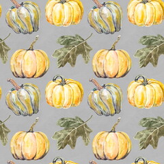 Seamless hand drawn pattern of ripe yellow pumpkins and green leaves on a grey background. Design for wallpaper or textile of harvest festival or halloween party.