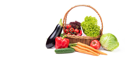 variety of fresh and ripe vegetables in basket isolated on white background with copy space