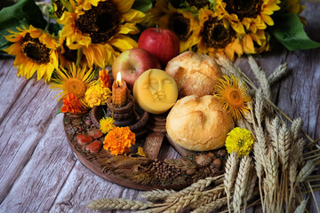 Wiccan Altar for Lammas, Lughnasadh pagan holiday. wheel of the year with ears of wheat, amulet,...