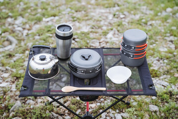 Camping utensils, compact camping gear, outdoor cooking equipment, camping table, small kettle, soup pan.