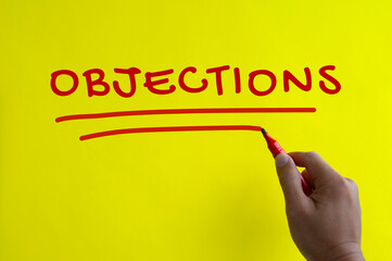 Hand writing objections text on yellow background. - obrazy, fototapety, plakaty