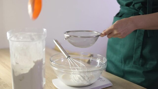 The confectioner kneads the dough
