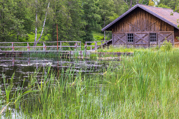 Old wooden mill house by a river