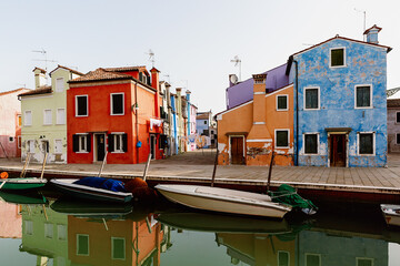 Fototapeta na wymiar Street with colorful houses on the island of Burano in the morning. Italy.